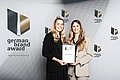 Handing over of the award during the event to Janine Hellwig und Vanessa Schekalla. Source: German Brand Award